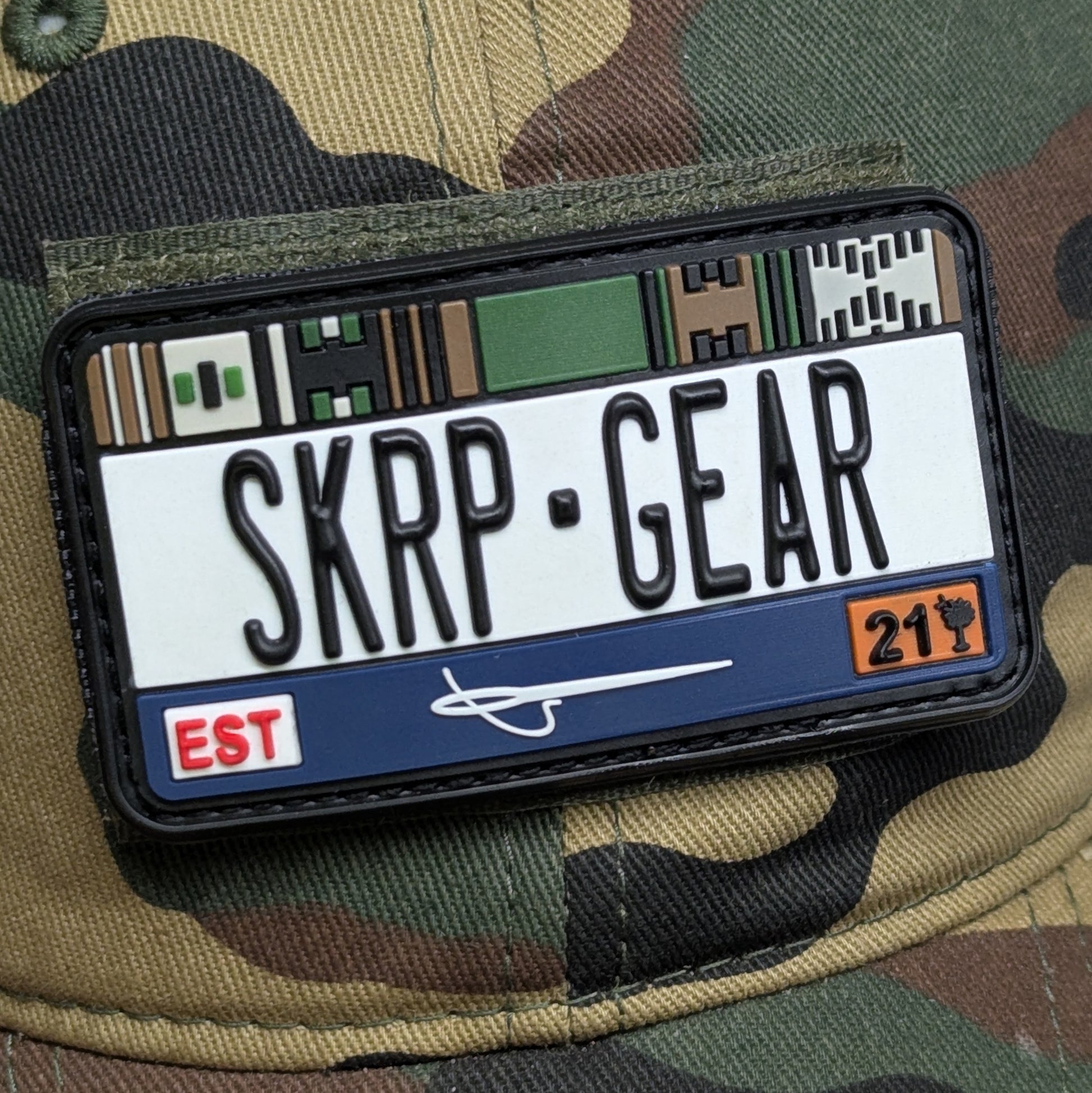 Patch with 'SKRP GEAR' text on a camouflage background